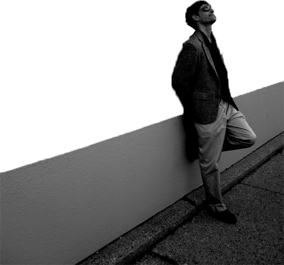 William leaning against wall